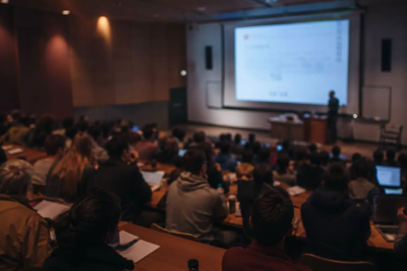 Students in a university lecture hall during a lecture